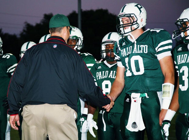 San Francisco 49ers' coach Jim Harbaugh has a special handshake for Palo Alto quarterback Keller Chryst, who is the son of 49ers' quarterback coach Geep Chryst. 