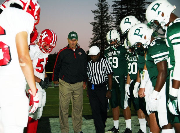 San Francisco 49ers' head coach Jim Harbaugh at a different sort of coin toss than he's used to. 