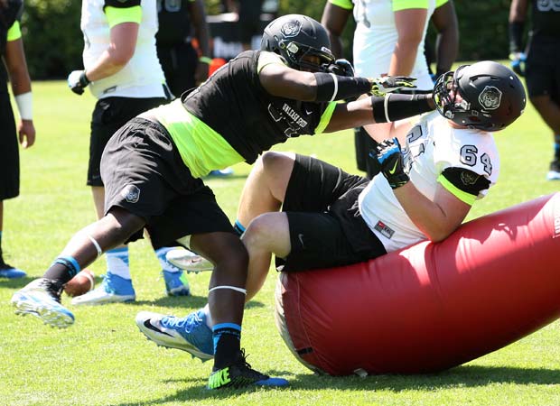 Two linemen battle during the Lineman Challenge.