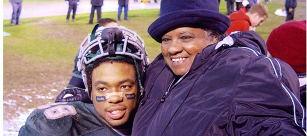 Terrance Kelly as a young football player with his beloved grandmother Bevelyn Kelly. 
