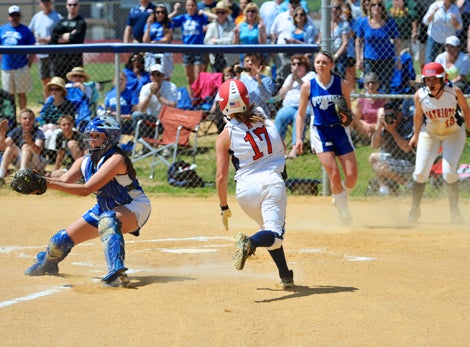 Kayla Grantham is about to avoid the tag to score Northern's first run and the only one it needed in a 3-0 victory over O'Connell in a showdown of the nation's top two teams.