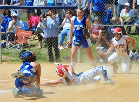 Kayla Grantham slides in safely giving her team a 1-0 lead.