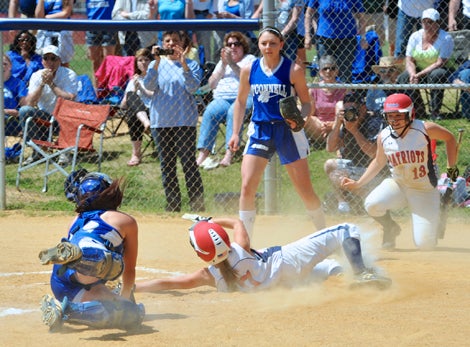 Kayla Grantham slides in safely giving her team a 1-0 lead. 