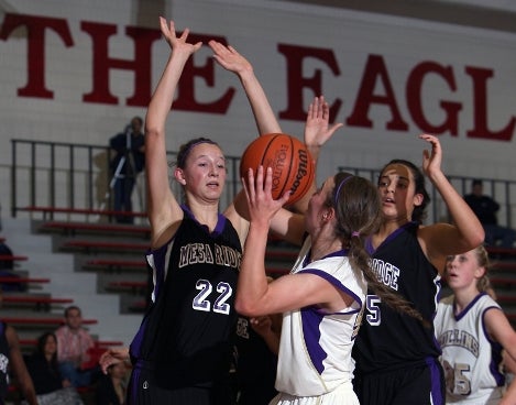 Kylee Shook (22), a 6-foot-4 freshman, has made a huge impact for Mesa Ridge this season. The Grizzlies are the lone unbeaten team in Class 4A as the state tournament draws closer.
