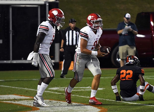 St. John's quarterback Sol-Jay Maiava (9) scored an early touchdown before the weather hit.