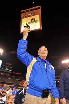 Harry Welch holds up a CIF trophy
for the ninth time.