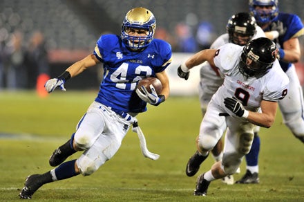 Santa Margarita sophomore Alex Suchesk makes a great cut during Saturday's win at Angel Stadium.