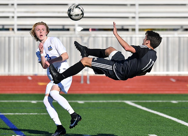 Cal Cranfill of Lovejoy (Lucas, Texas) attempts a bicycle kick against Midlothian in the semifinals of the UIL 5A Region 2 playoffs.