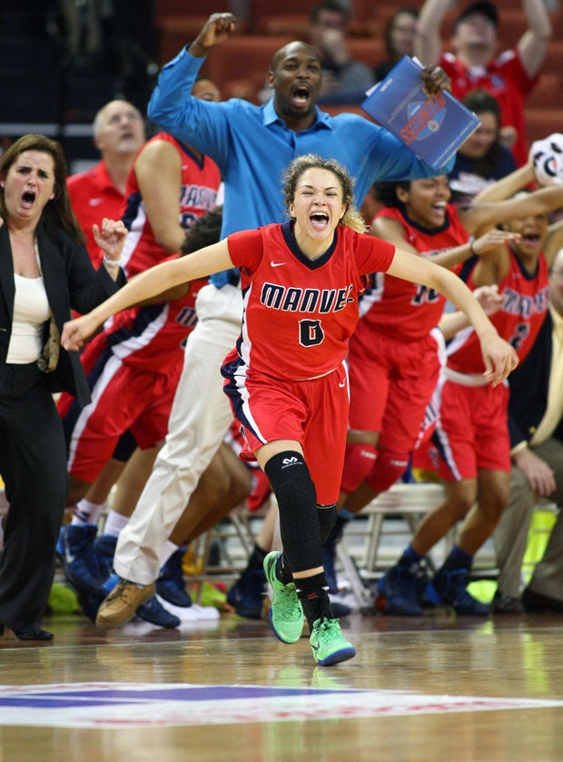 Amelya Jackson storms the court after Manvel's stunning 58-53 win over Duncanville in the 5A state finals Saturday. The win broke Duncanville's 105-game win streak. 