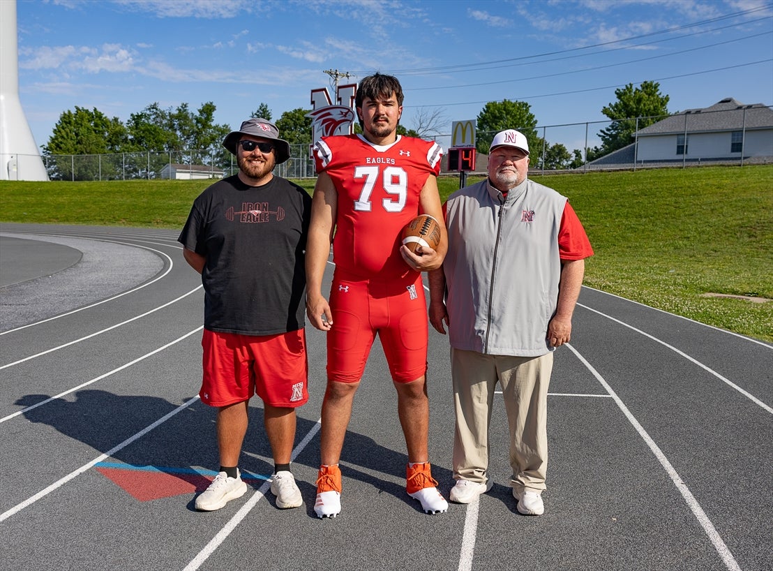 Cantwell stands with his head football coach John Perry and shot put/offensive lineman coach Kenzie Medley. (PHOTO: Claudia Rozell)