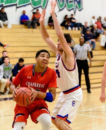 Chaparral junior Ronnie DeGray has the Wolverines (10-2)
in the thick of the Class 5A title chase. DeGray is averaging
20 points a game at the midpoint of the season. 