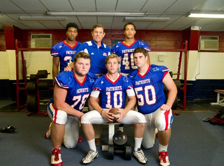Curtis coach John Curtis with several of his returning starters.