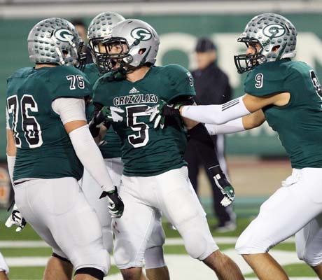 John Cooley celebrates after scoring the second of his four touchdowns.