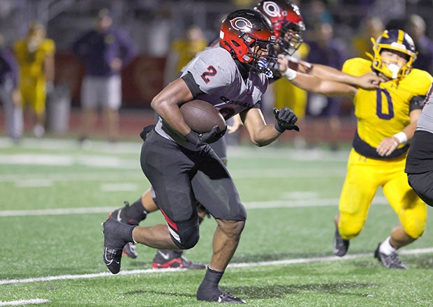 Cornell Hatcher looks for yards against Punahou of Hawaii earlier this month, a game where he piled up 336 rushing and receiving yards. (File photo: Steven Silva)