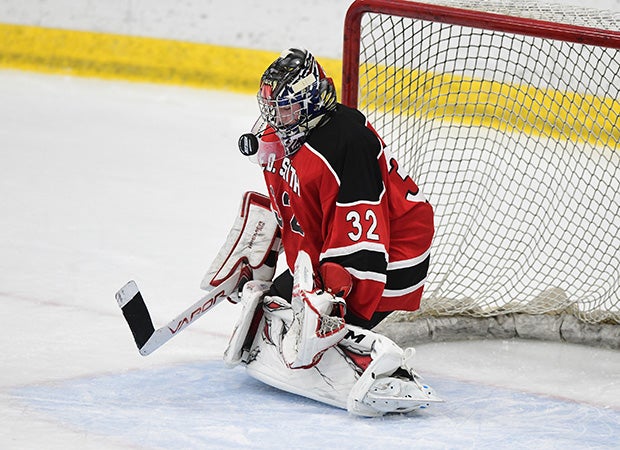 Goalie Harry Cook of Edwin O. Smith (Conn.) eyes a shot before deflecting it during a game against Guilford at the University of Connecticut.