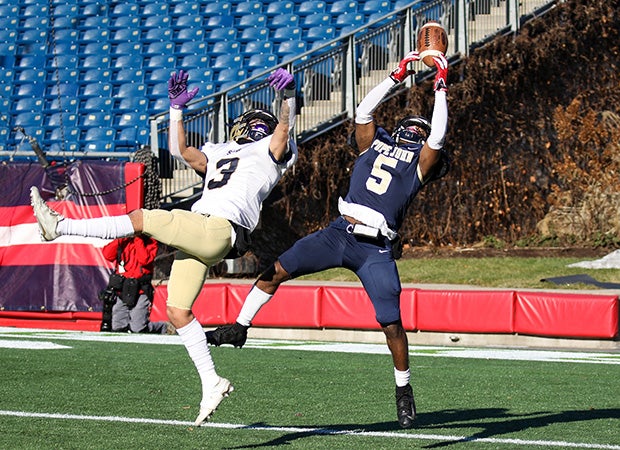 Pope John XXIII (Mass.) receiver Roshad John makes a fingertip catch for a touchdown against St. Bernard's Central Catholic in the MIAA Division 8 title game at Gillette Stadium.