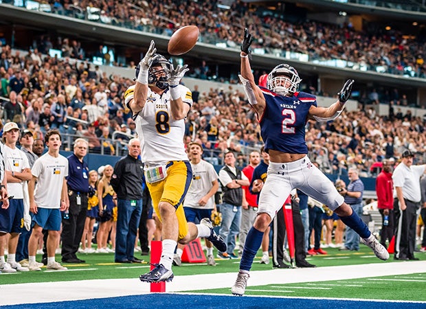 Highland Park (Texas) receiver Bennett Brown scores a touchdown reception against Ryan in a UIL 5A Division 1 semifinal game at AT&T Stadium in Arlington.