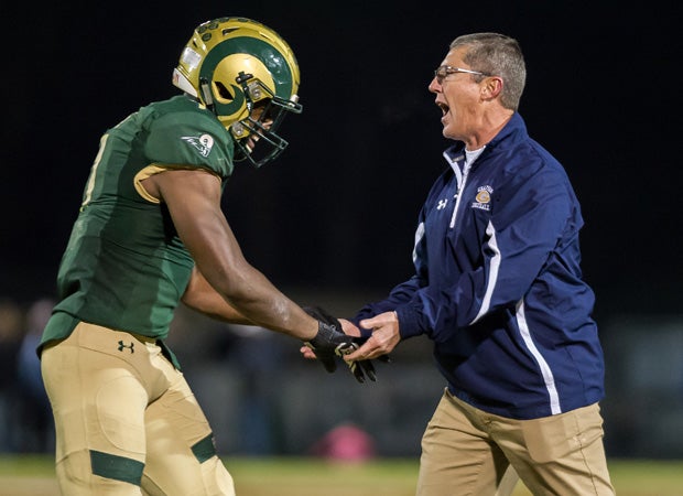 Grayson head coach Jeff Herron congratulates one of his players.