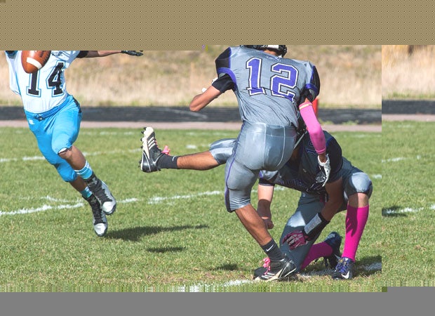A Vista Ridge (Colo.) junior varsity player attempts to block a field goal attempt against Discovery Canyon.