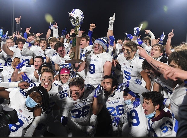St. Xavier players celebrate their Ohio Division I state title on Friday after beating Pickerington Central 44-3.