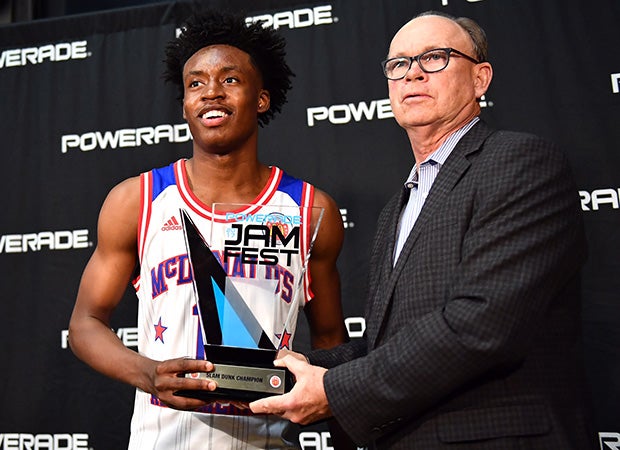 Sexton receives the trophy for winning the dunk contest.