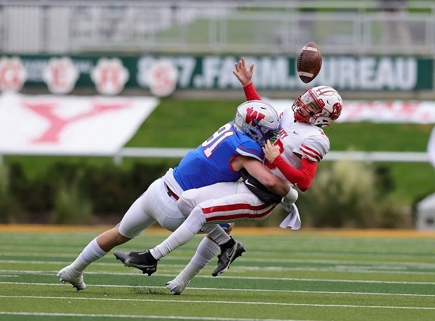 Colton Vaskek forces a Caleb Koget fumble in the Chaps' 45-14 win over Katy on Saturday.