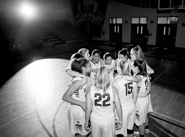 Whitney (Rocklin, Calif.) players huddle up before the start of their game against Cosumnes Oaks (Elk Grove, Calif.).