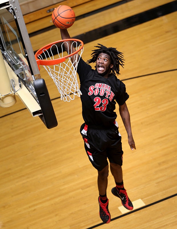 Omaha South (Neb.) forward Caleal Walker soars in for a dunk against Lincoln Southeast.