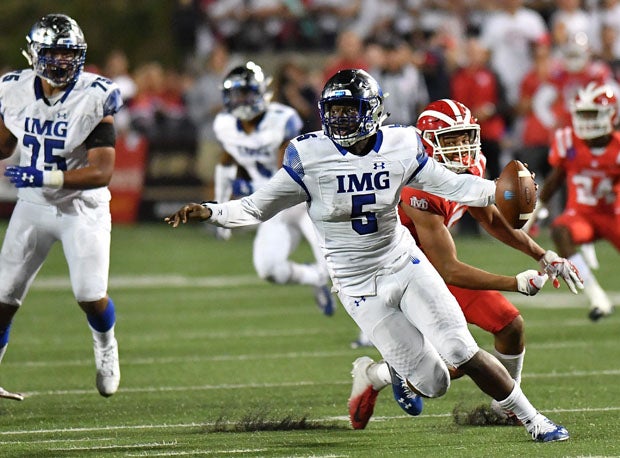 IMG quarterback David Baldwin gets away from a strong rush. 