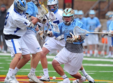 The faceoff work of Joe McCallion (right) allowed Haverford to take control of Darien. 