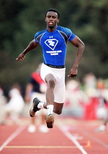 Jarrion Lawson fought off pain to 
win the triple jump, his second 
championship in two days. 
