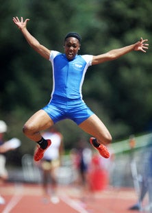 Robin Reynolds soars to her title
in the long jump. 