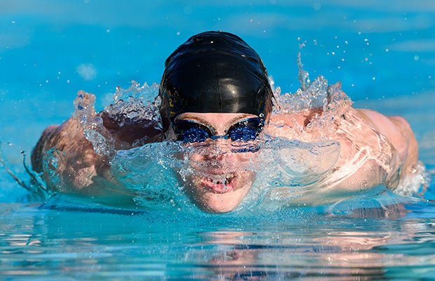 A Folsom (Calif.) swimmer competes in the boys' 100-meter butterfly during a meet against Oak Ridge.