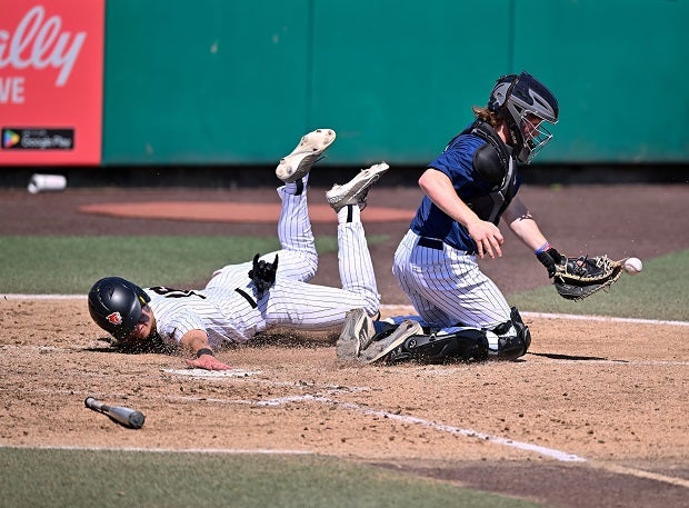 A runner is safe at home during the West Seattle vs. Lincoln WIAA 3A State Semifinals at Funko Field in Everett, Wash.(Photo: Patrick Krohn)
