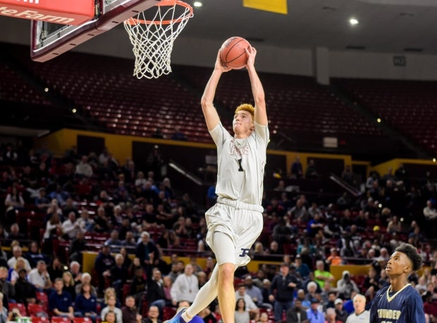 Nico Mannion rises for a dunk during Arizona's Class 6A semifinal game in February.