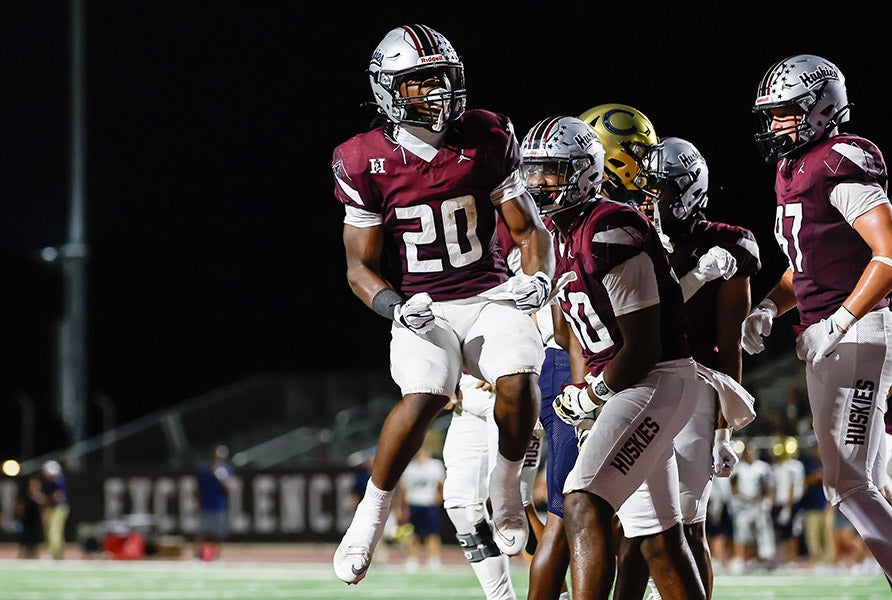 Junior running back Devante Roebuck of No. 15 Hamilton celebrates a touchdown against Casteel earlier this month. In the absence of star receiver Roye Oliver III, Roebuck has been the go-to offensive weapon for the Huskies, accounting for 790 yards and seven touchdowns. (PHOTO: David Venezia)