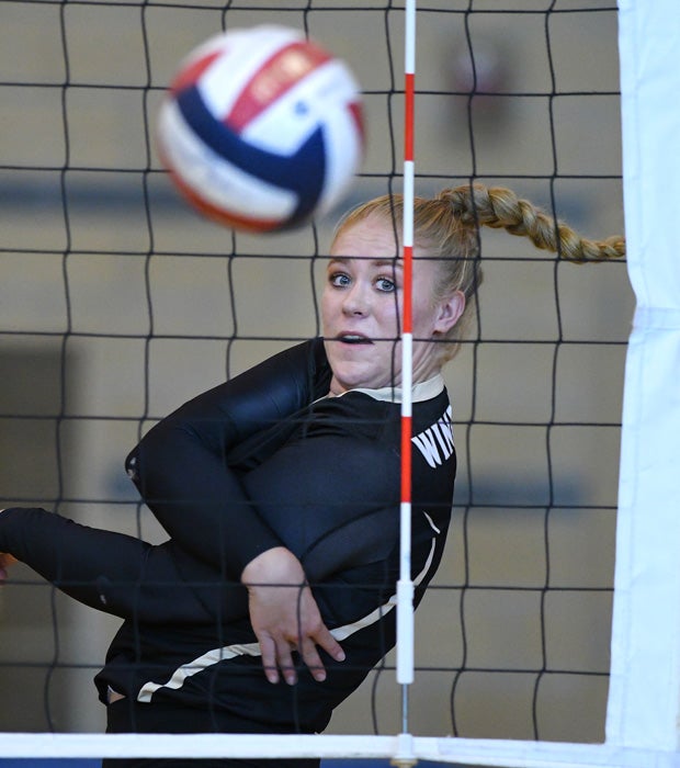Windsor (Calif.) outside hitter Allison Post eyes her spike shot during a match against Montgomery.