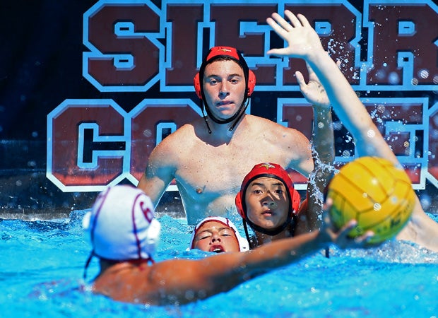 Vintage's (Calif.) Al Simpkins (foreground) prepares to take a shot as a Mills goalie looks on during the Sierra Shootout at Sierra College in California. 