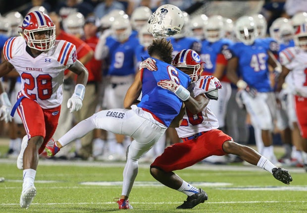 Allen (Texas) receiver Carson Schleker's helmet goes flying on this legal hit by Evangel Christian (La.) defensive back Craylon McGhee.