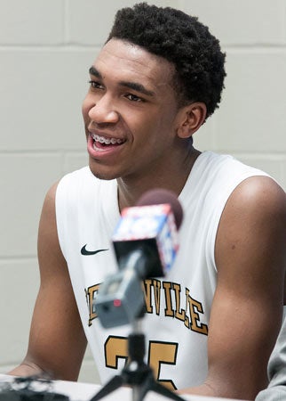 Malik talks to the media after last Friday's playoff win.Bentonville hasn't won a state title with him on theroster, but the program should be a contender againnext season.