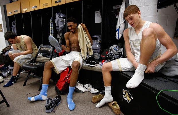 Malik enjoys a laugh with teammates while changing in the locker room following a recent practice. The youngster is enjoying the perks that come with playing for a school located in one of the most prosperous parts of Arkansas.