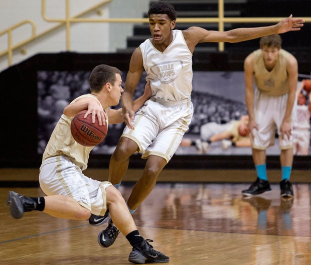 Malik closely guards a teammate during a recent practice. Teammates find ways to poke a little fun at the young man they have seen rise into national stardom.