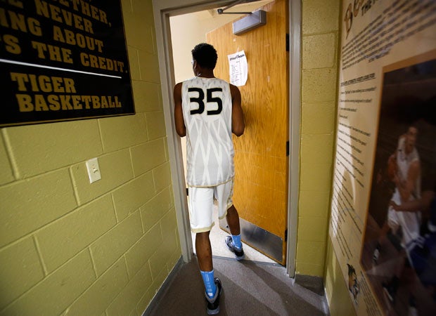 Malik exits the locker room while heading to the court for a recent practice.