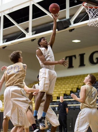Malik soars down the lane during a recent practice.