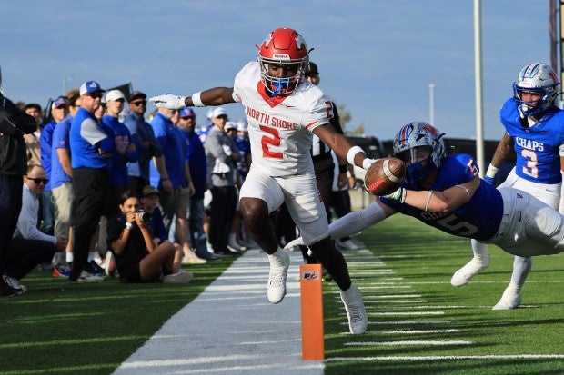 Three-star senior wide receiver Christopher Barnes takes North Shore down to the one yard line before quarterback Kaleb Bailey punched in the touchdown. (Photo: Paul Knight)