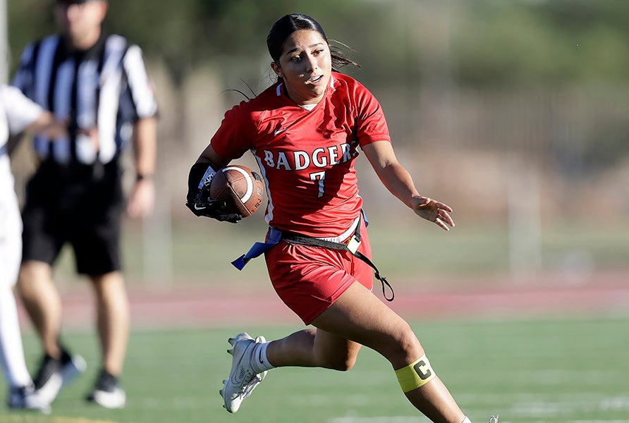Alexandria Nunez of Tucson Magnet runs for daylight during a flag football game in Arizona this week. More than 100,000 players participated in the sport during the 2025-26 year. (PHOTO: Chris Hook)