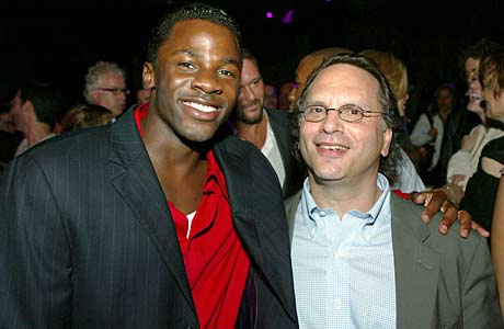 Derek Luke (left), who played Boobie Miles in the film version of 'Friday Night Lights,' poses with the author of the original book, Buzz Bissinger.