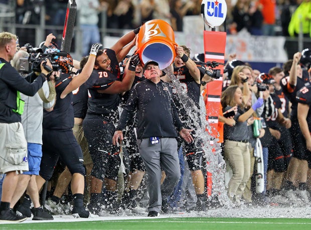 Aledo coach Steve Wood gets drenched in the fourth quarter of his team's 5A-II championship win over Marshall.