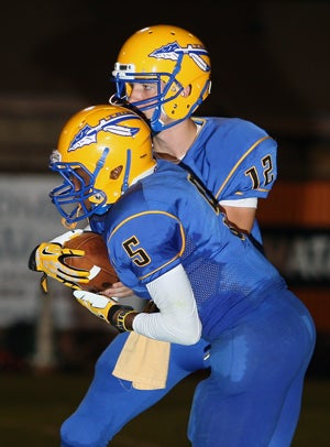 Datavion Thacker takes a handoff from Jacksonville
teammate Carter McCown last year.