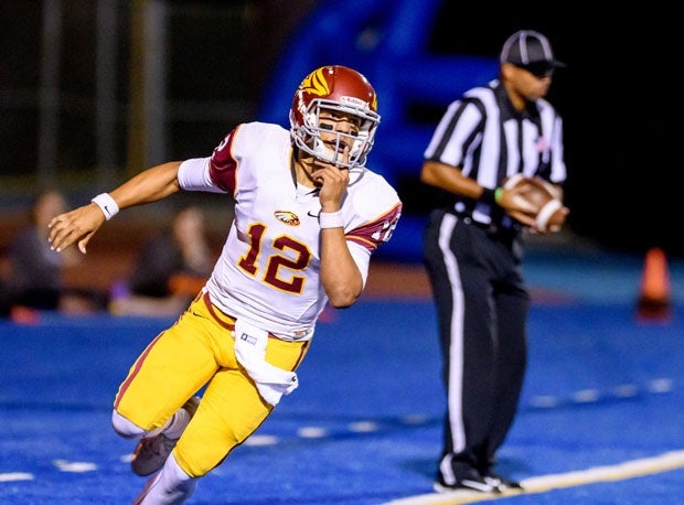 Tennessee-bound QB Adrian Martinez sprints to his bench after scoring a touchdown for Clovis West.